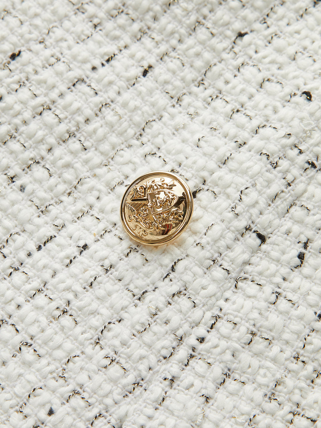 Hedwig - Minirock aus plissiertem Tweed mit Metallknöpfen