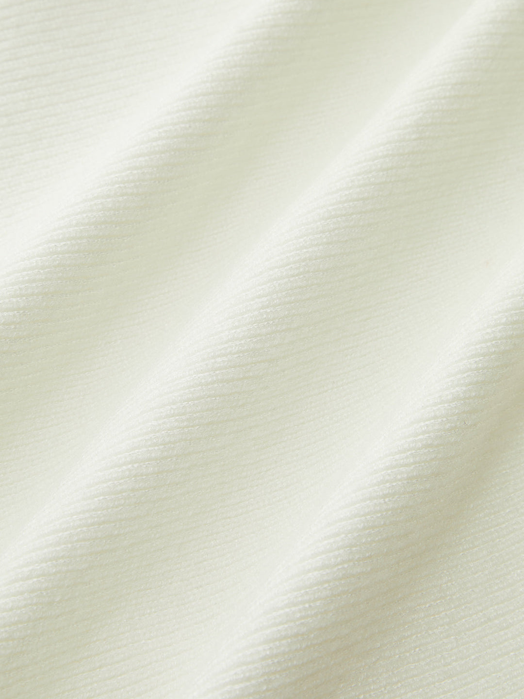 Enya – Strickoberteil mit Schleife und Schößchen
