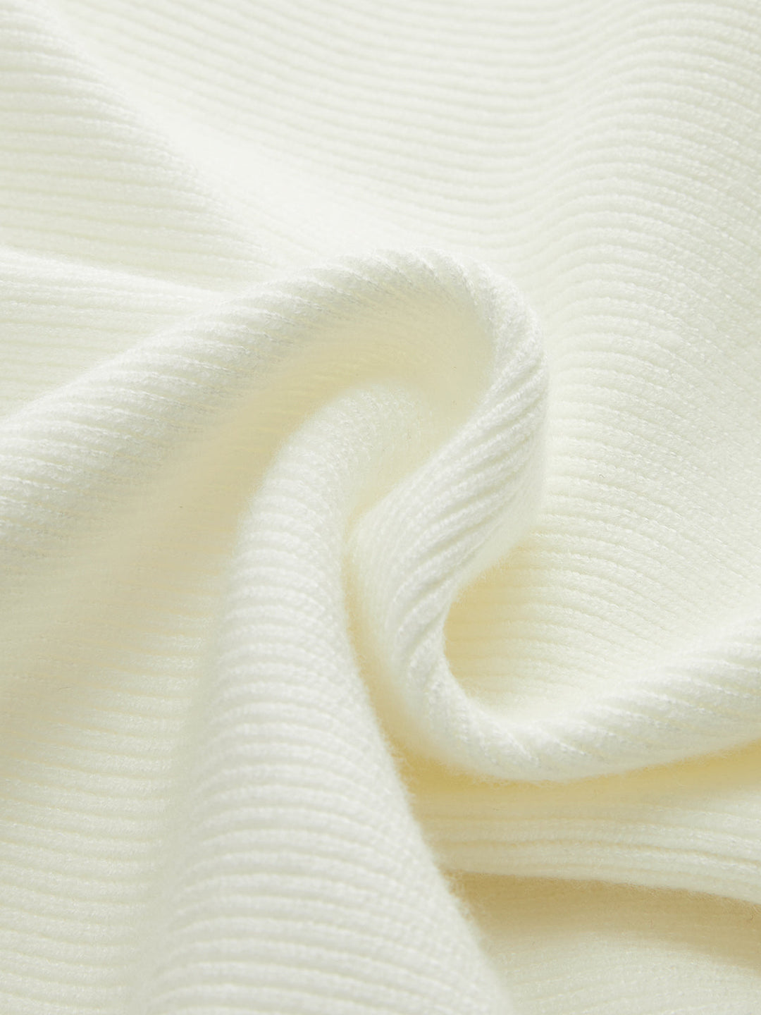 Enya – Strickoberteil mit Schleife und Schößchen