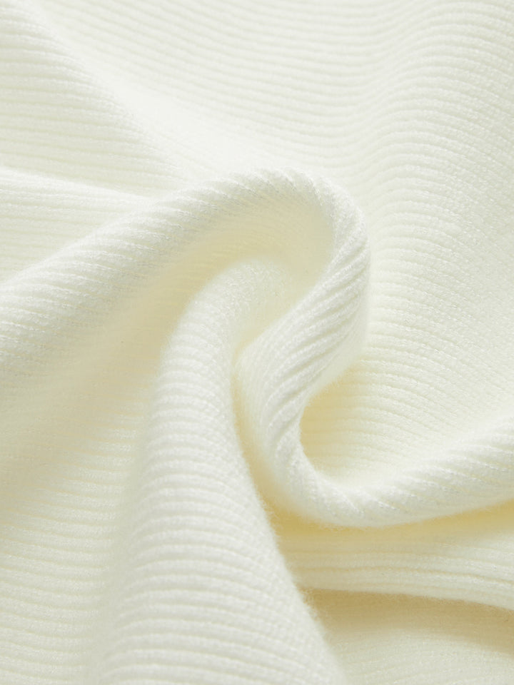 Enya – Strickoberteil mit Schleife und Schößchen